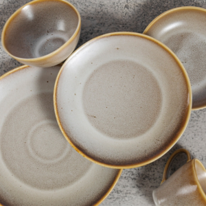 this tableware features a unique reactive glaze finish that adds a touch of sophistication to any setting. Each piece is crafted from durable porcelain, ensuring long-lasting quality for everyday use or special occasions.